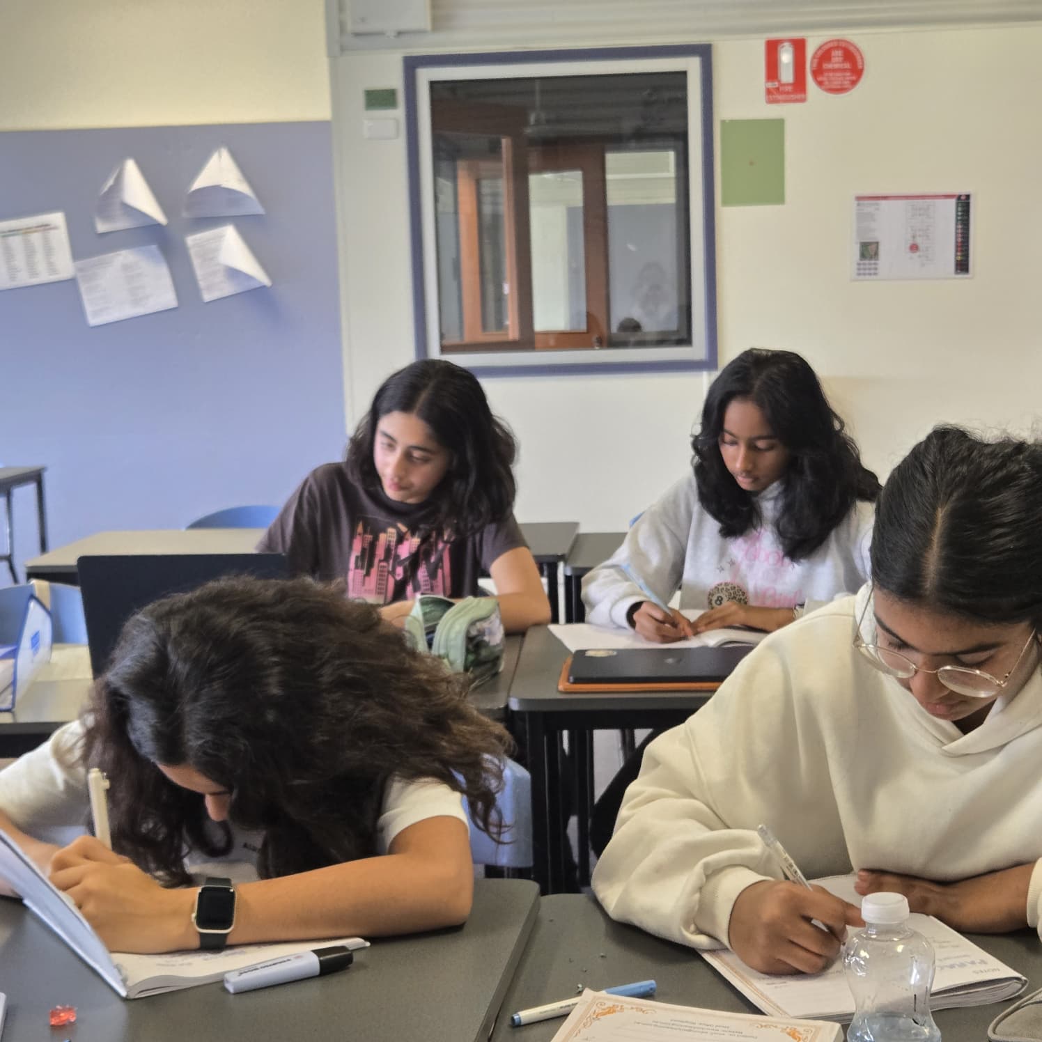 Senior students working through VCE tutoring material