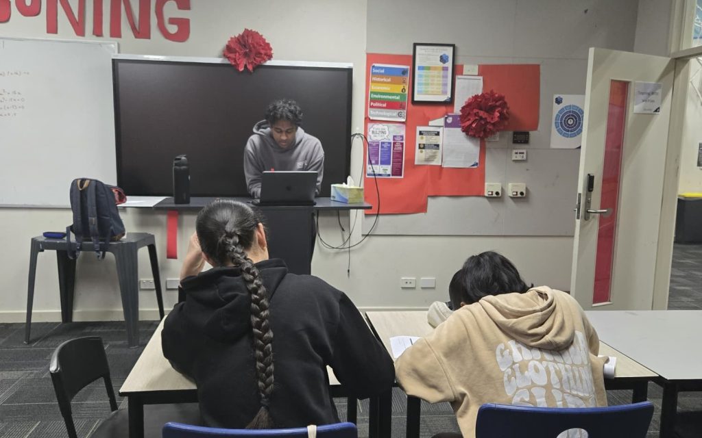 Older VCE students in a focused classroom session