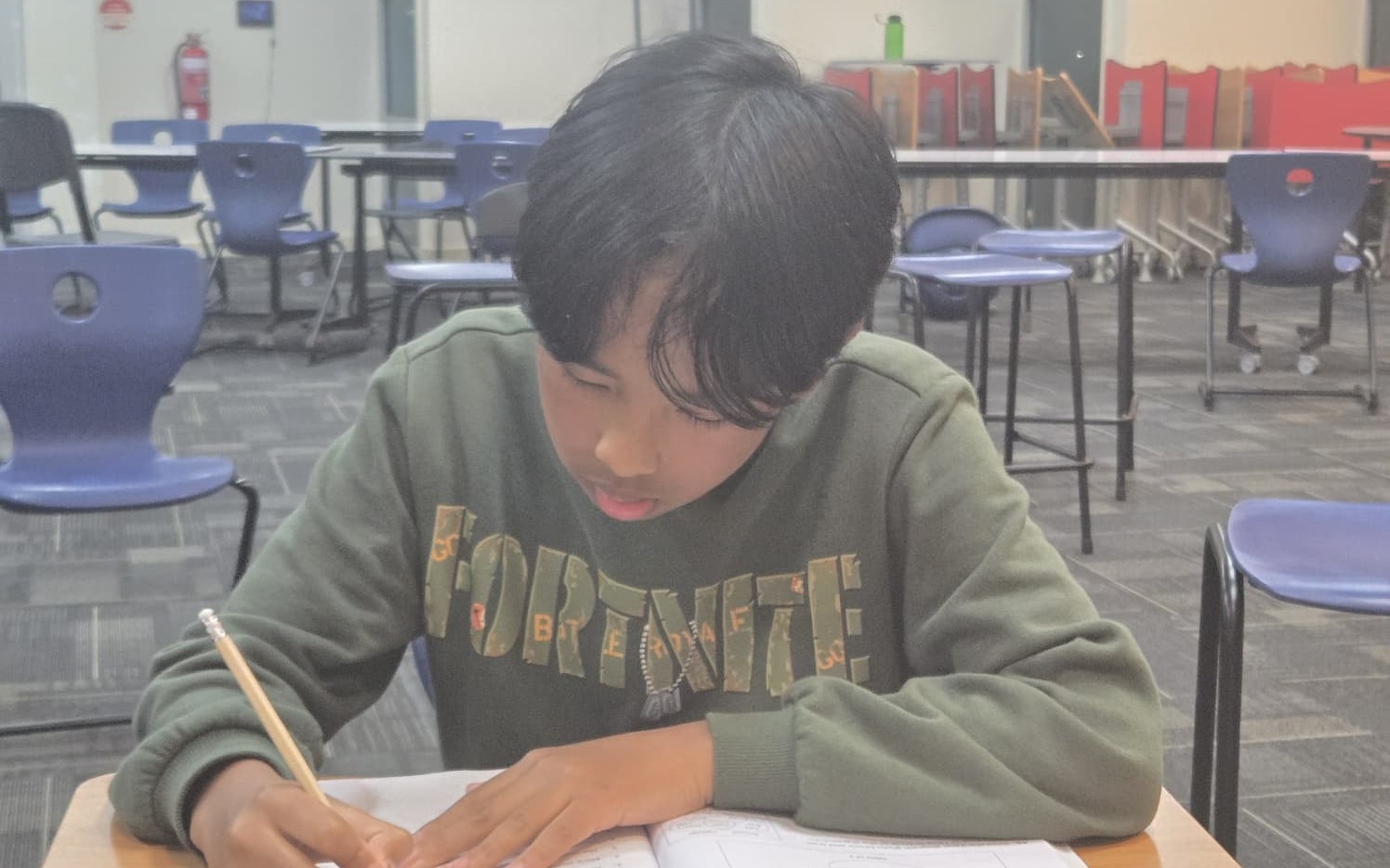 Early teen student practising English inference
