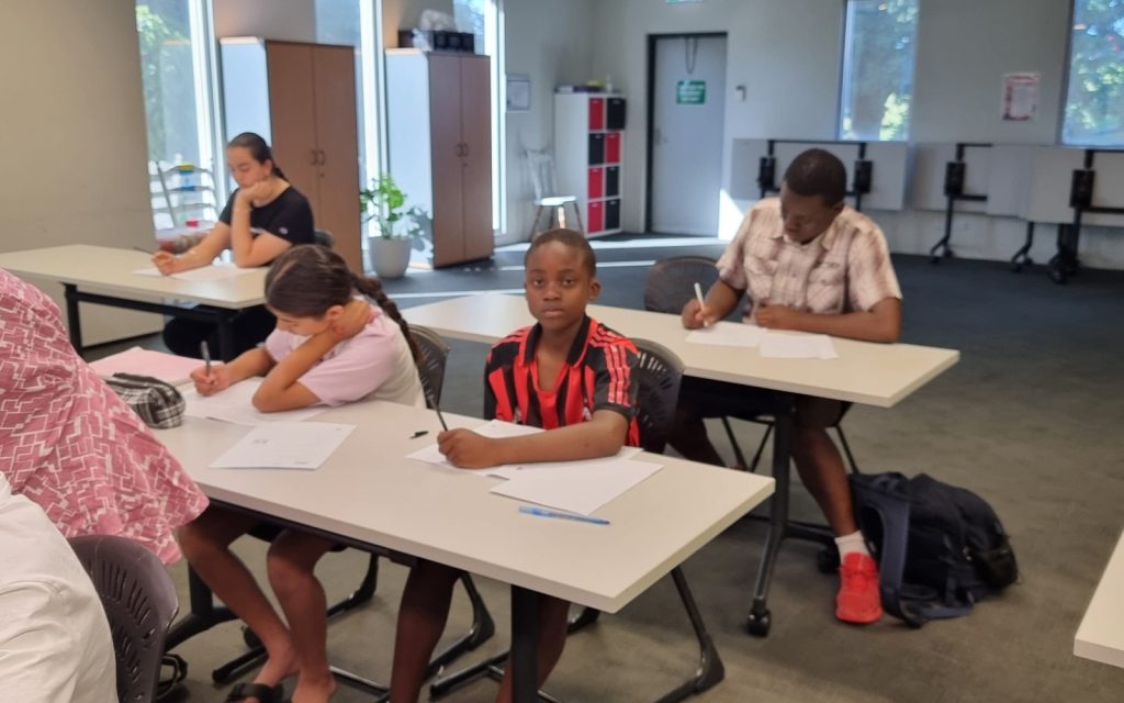Small group of students working in a NRICH Learning classroom